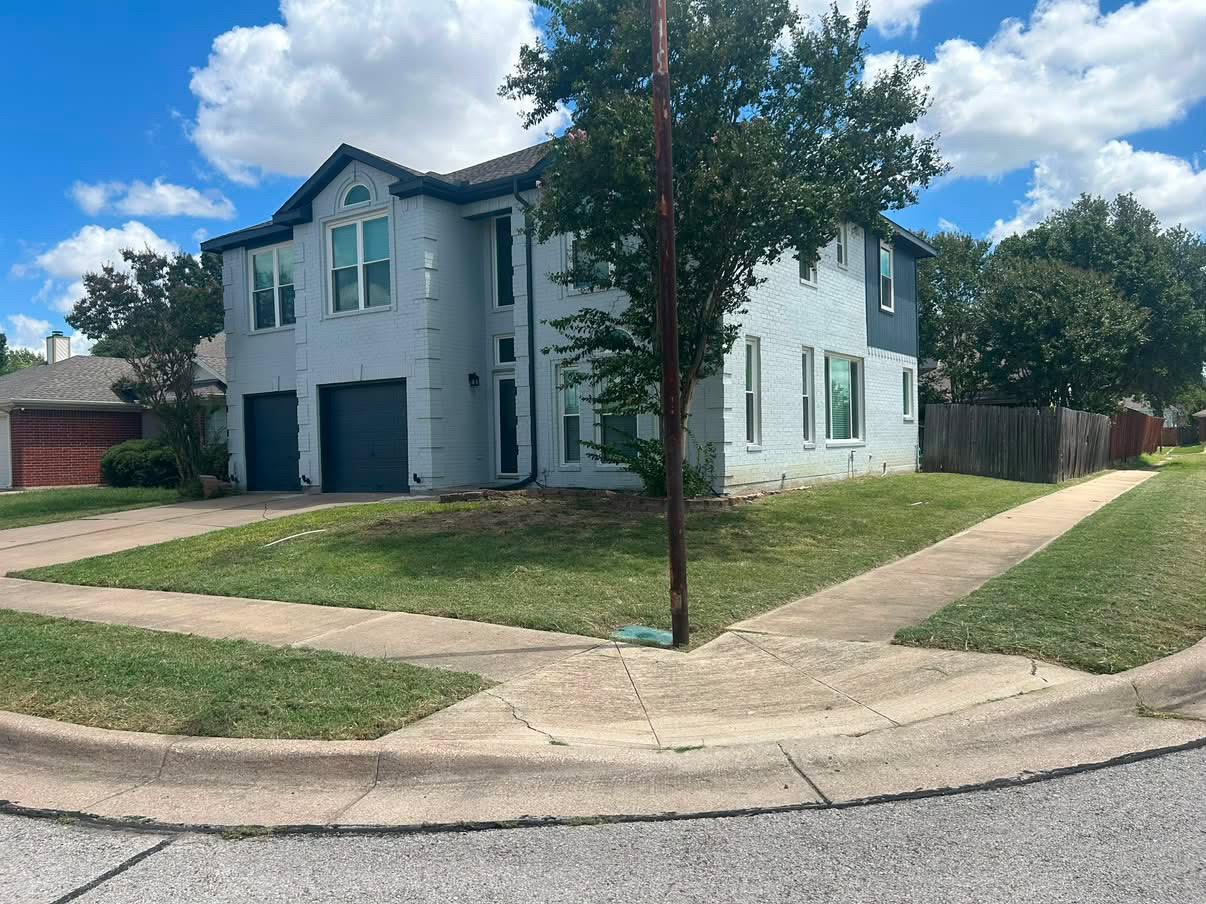 Two-story home lawn mowing & perimeter trimming — after